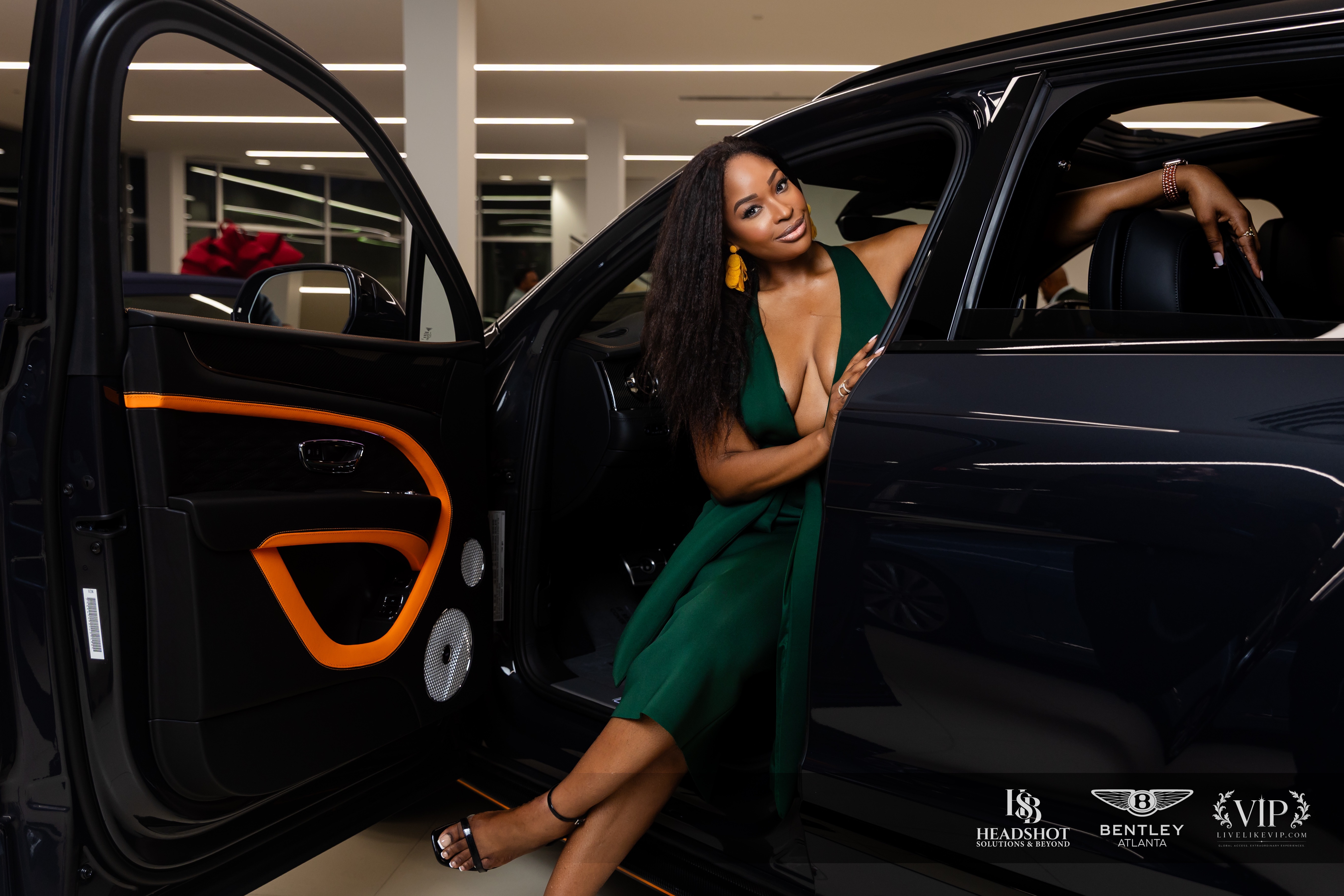 Lydia Pierre stepping out of a Bentley in an emerald dress
